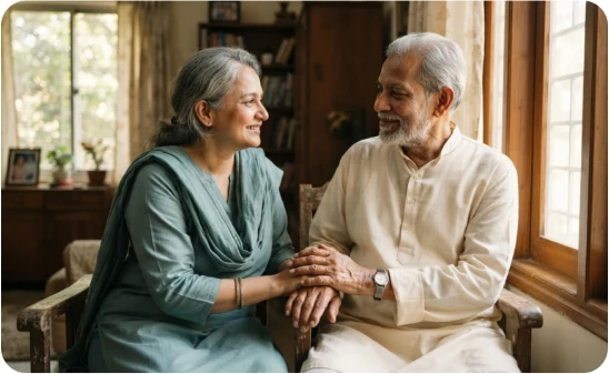 An older couple sitting together warmly at home