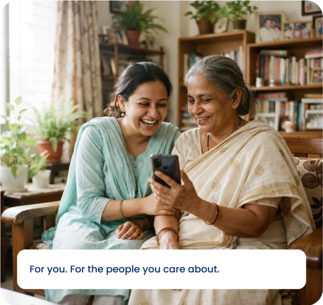 A younger woman and an older woman enjoying a moment together while looking at a phone